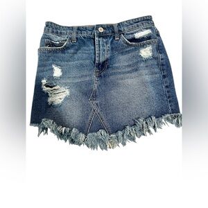 KanCan women’s Distressed Denim skirt with raw fringe hem.